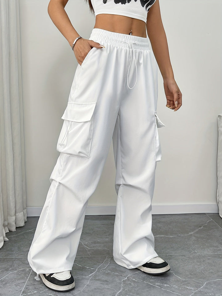 Women's wide leg cargo pants with drawstring waist. Relaxed fit, ideal for casual streetwear fashion.