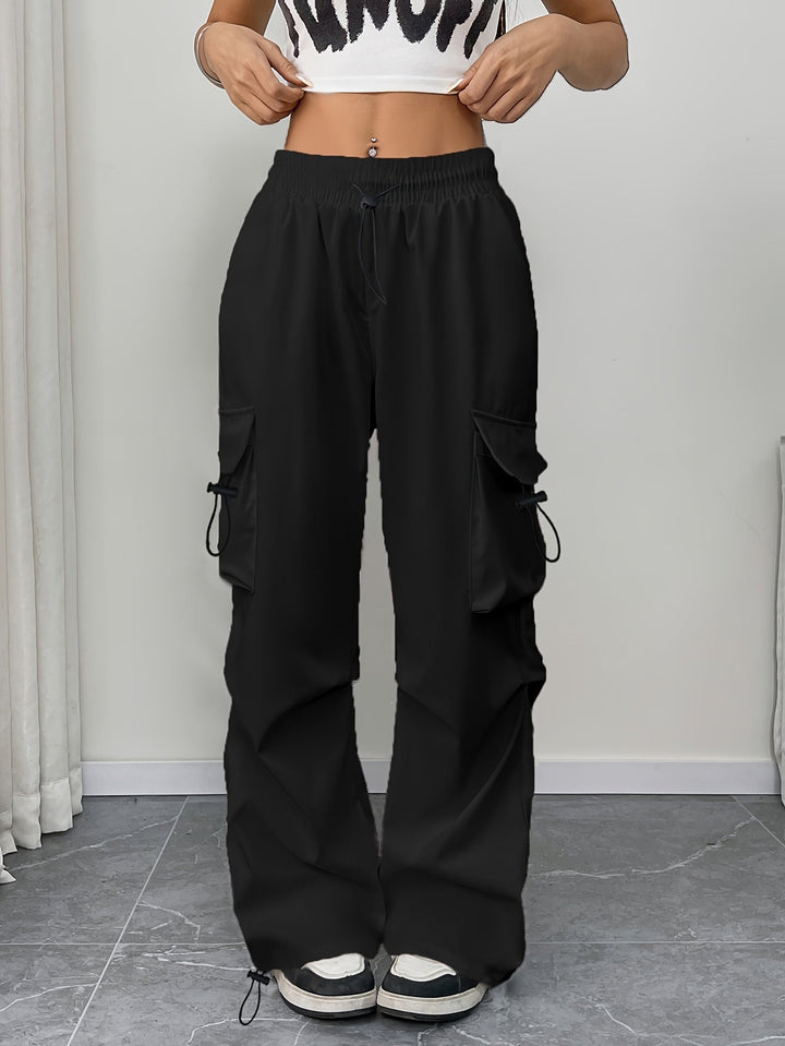 Trendy women's wide leg cargo pants, comfortable drawstring waist, utility pockets. Great for casual wear.