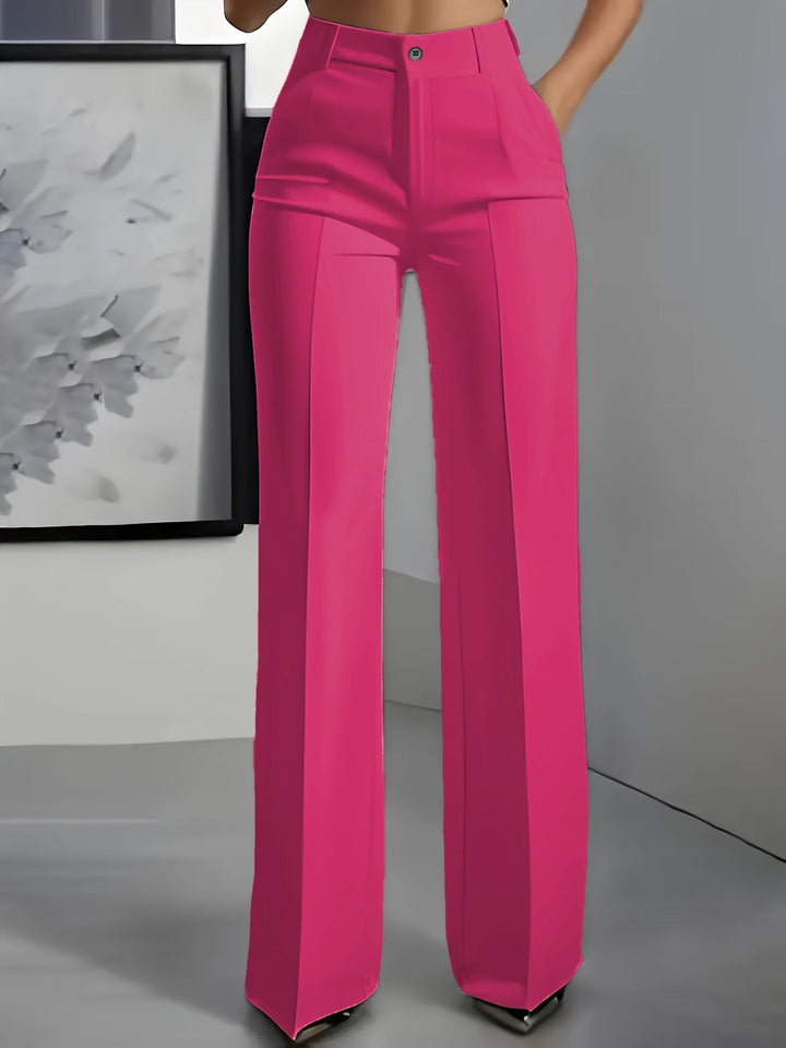Model wearing stylish women's wide leg high waist trousers, showcasing their structured fit & fashion.