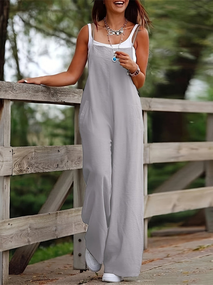 Relaxed fit women's sleeveless wide leg dungaree jumpsuit with practical pockets.