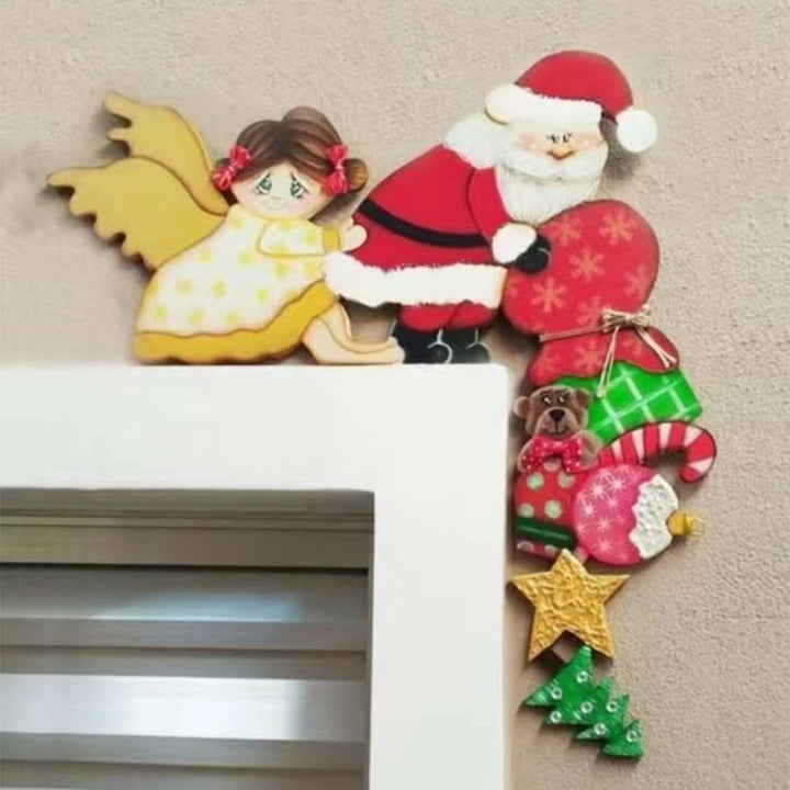 Christmas door frame decor showing an angel and Santa, a beautiful wooden holiday piece.