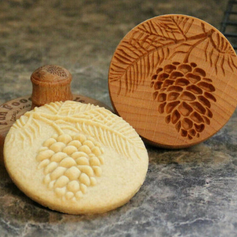 Close-up of a wooden cookie mold, showcasing its detailed embossing pattern for crafts