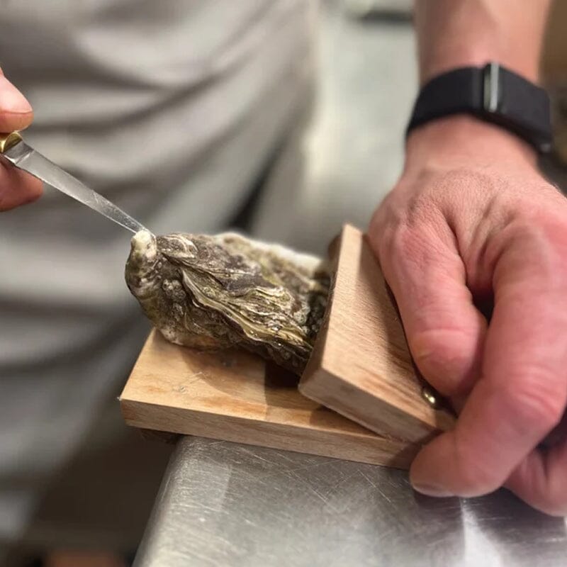 Ergonomic wooden oyster shucking clamp, designed for easy and safe oyster shucking