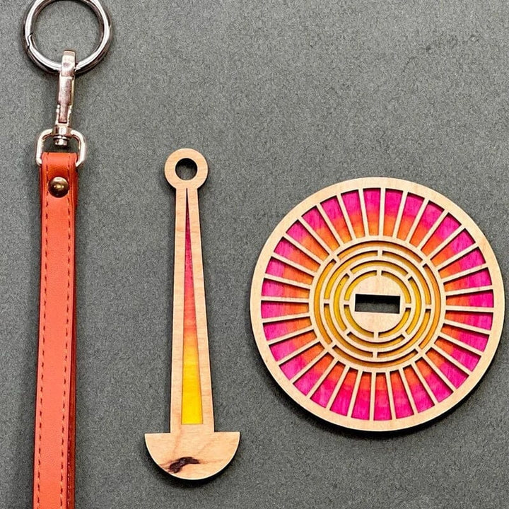 Unfinished wooden rotating yarn holder, ready for your next knitting or crochet project.