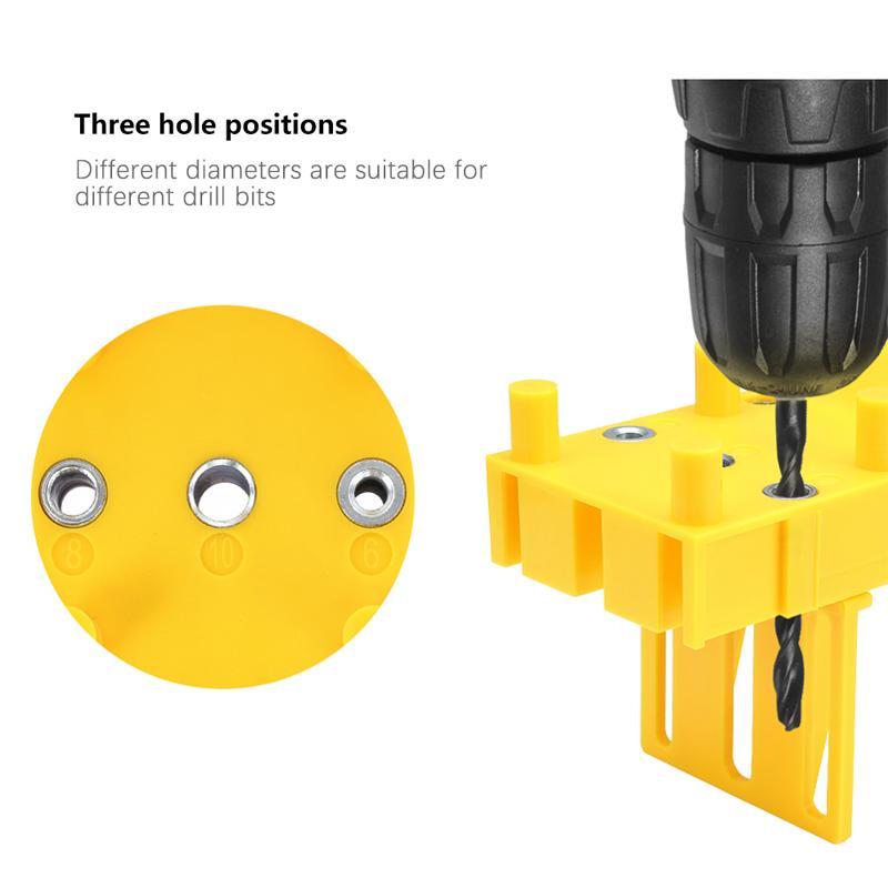 Carpentry drilling aid: Dowel jig tool shown in use, ensuring accuracy and alignment