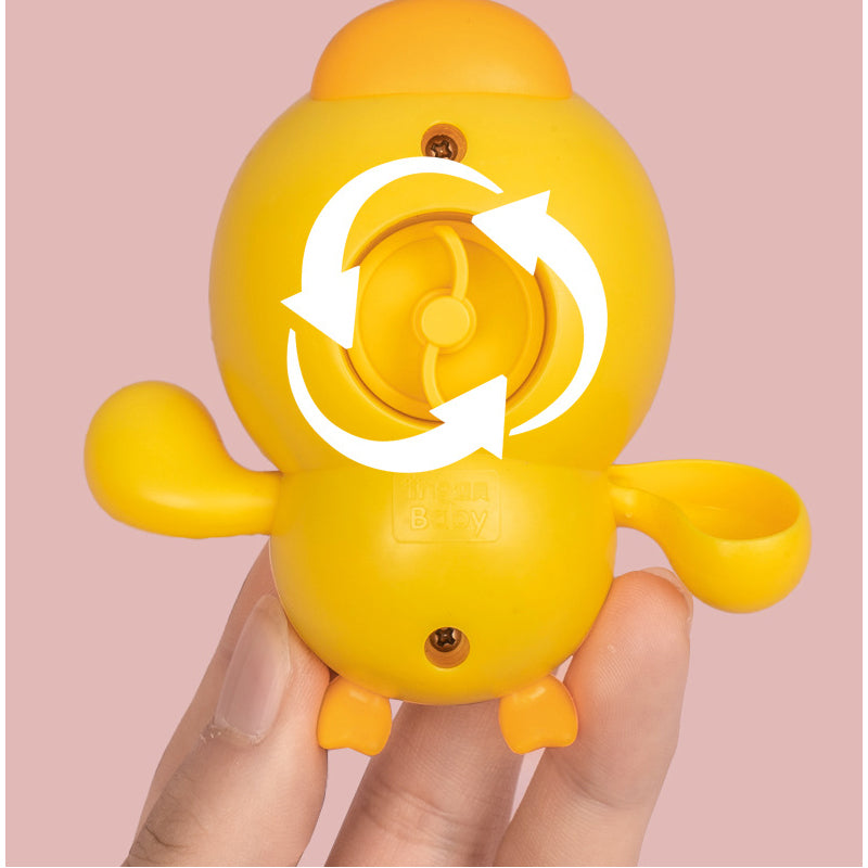 Yellow duck wind-up toy on a white background, demonstrating its simple, safe design for toddlers