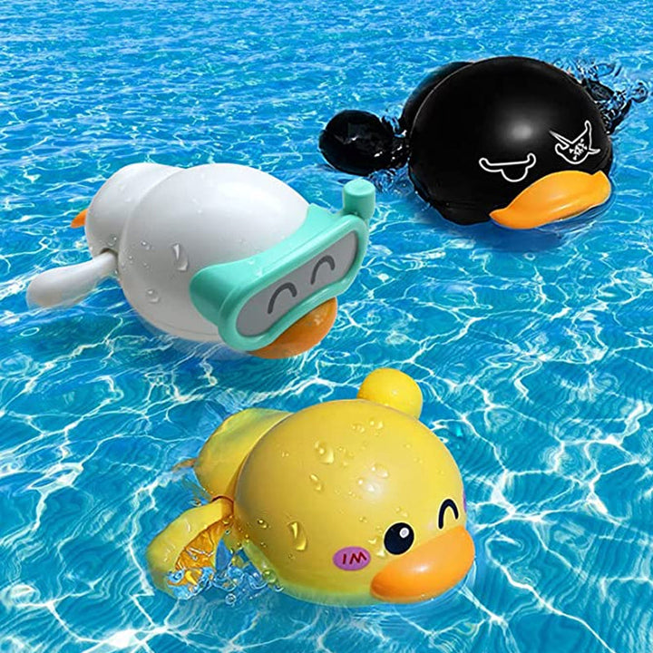Close-up of a smiling yellow wind-up duck bath toy, ideal for baby gift and nursery