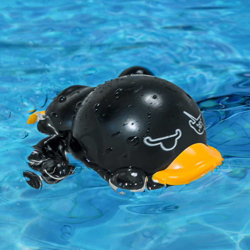 Wind-up duck bath toy with water splashing around it, creating exciting water play for babies