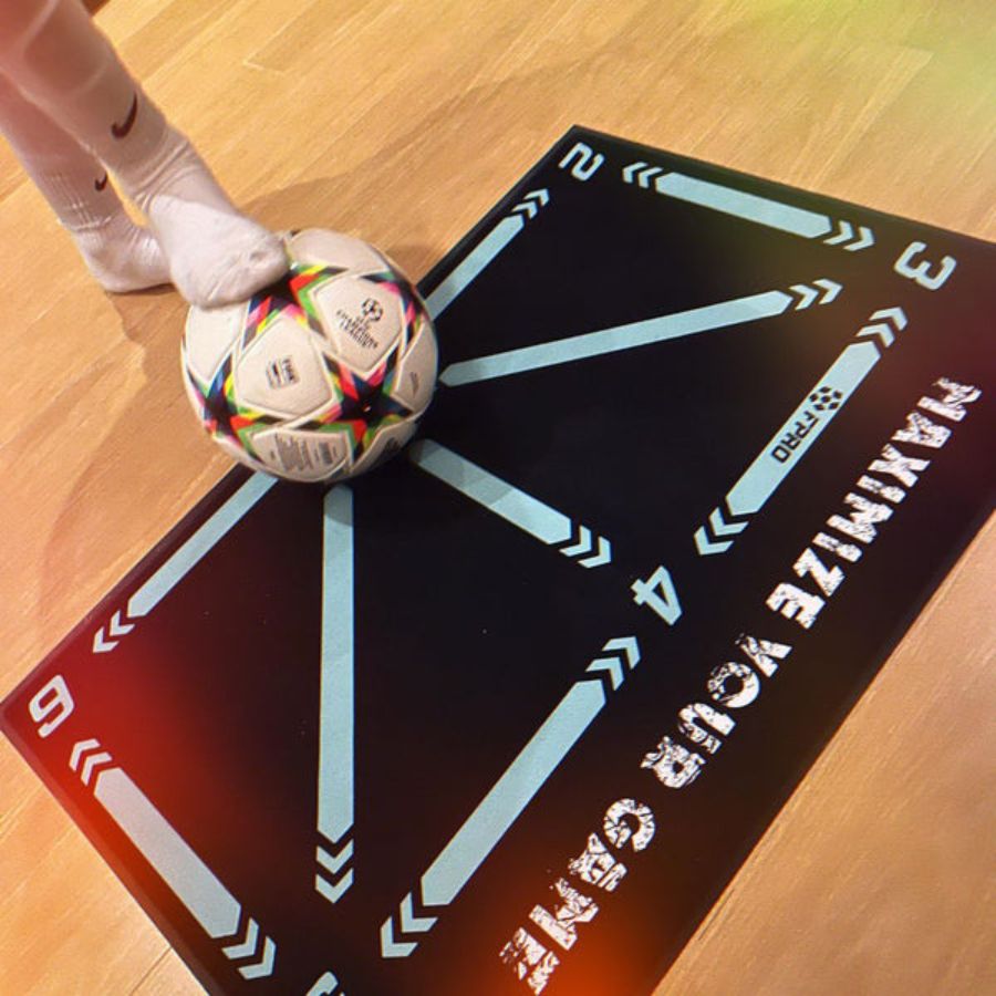 Kid's soccer training mat with integrated video coaching program to boost football skills indoors.